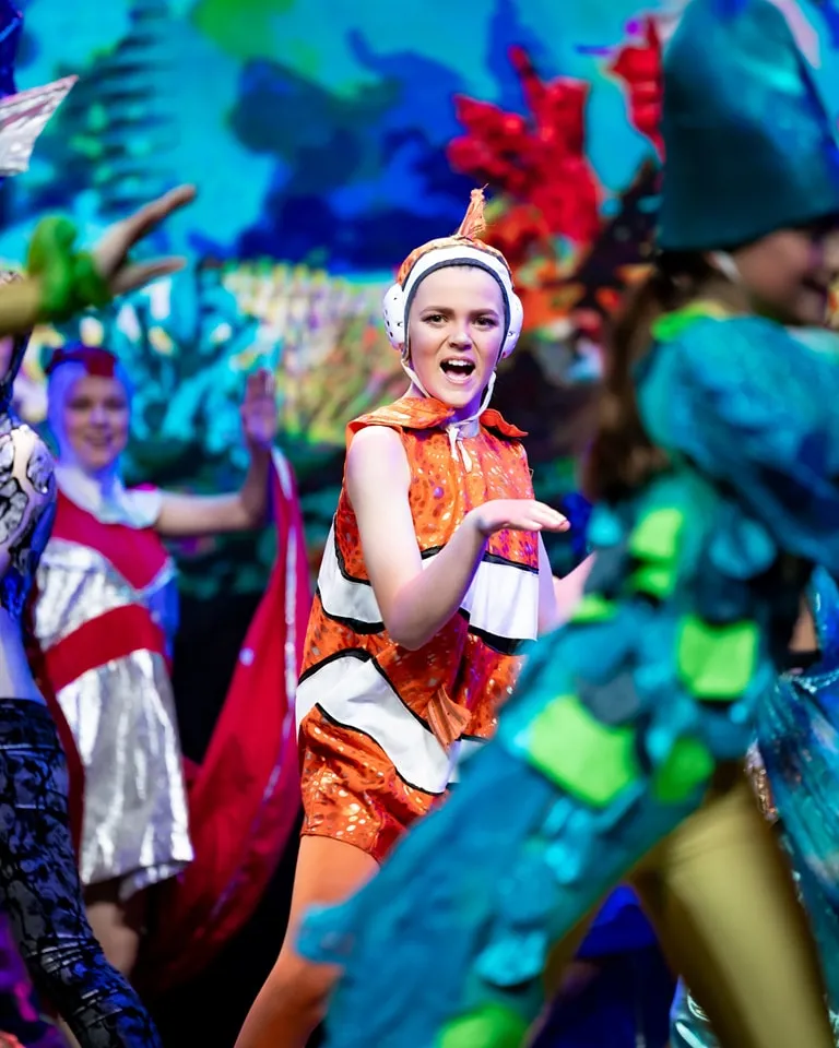 The Little Mermaid ensemble mid-song on the SYMT stage